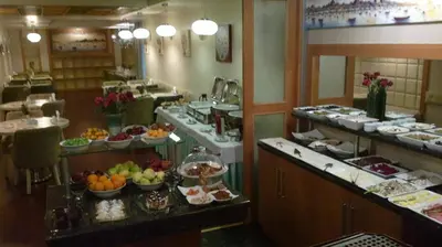 a buffet line in a restaurant with fruits and food at Dareyn Hotel in Istanbul
