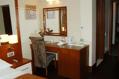 a bathroom with a desk with a mirror and a sink at Dareyn Hotel in Istanbul