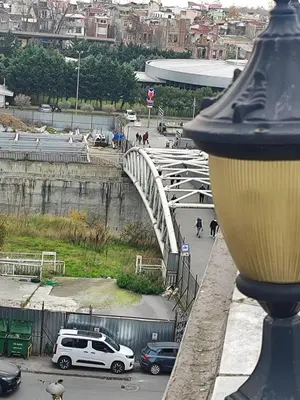 a white car parked next to a white bridge at Hotel Ay in Istanbul