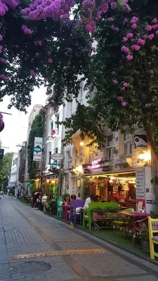 a city street with tables and chairs and buildings at Romantic Mansion in Istanbul
