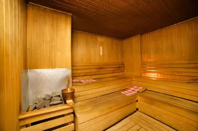 a large wooden sauna with a wooden floor and wooden walls at Amethyst Hotel in Istanbul