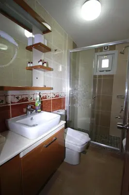 a bathroom with a sink and a toilet and a shower at Agora Boutique Hotel & Bistro in Istanbul
