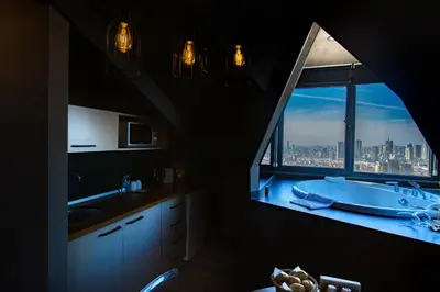a bathroom with a tub and a large window at Cityloft 161 in Istanbul