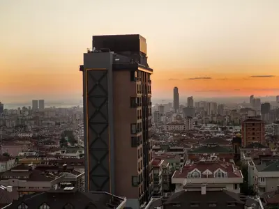 a tall building in a city at sunset at Cityloft 161 in Istanbul