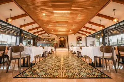 a dining room with white tables and chairs at Millennium Istanbul Golden Horn in Istanbul
