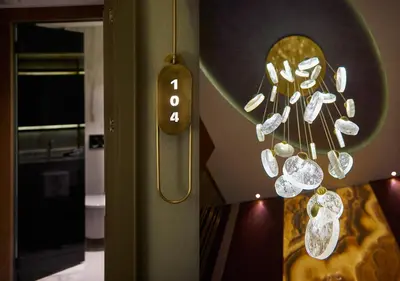 a bunch of crystals hanging from a wall at Dundar Hotel & Spa in Istanbul