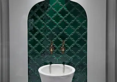 a bathroom with a green wall with a urinal at Dundar Hotel & Spa in Istanbul