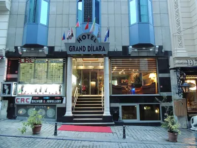 a store front of a building with a red rug in front at Grand Dilara Hotel in Istanbul