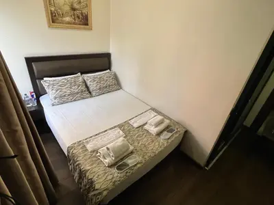 a small bed in a small room with shoes on it at Pandora Hotel in Istanbul
