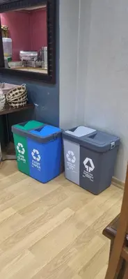 two trash cans sitting on the floor in a room at Hotel Akyildiz in Istanbul