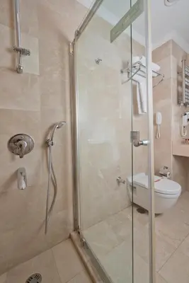 a bathroom with a glass shower with a toilet at Emporium Hotel in Istanbul