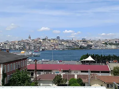 a view of a city with a boat in the water at Golden Horn Bosphorus Hotel in Istanbul