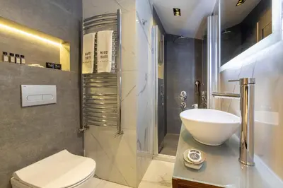a bathroom with a sink and a toilet at Nardi Nişantaşı in Istanbul