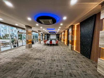 a hallway in a building with a blue ceiling at Elegance Resort Hotel & SPA Wellness-Aqua in Yalova