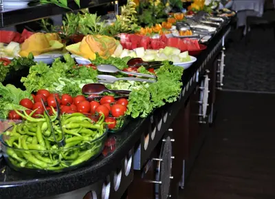 a row of tables filled with vegetables and fruits at Elegance Resort Hotel & SPA Wellness-Aqua in Yalova