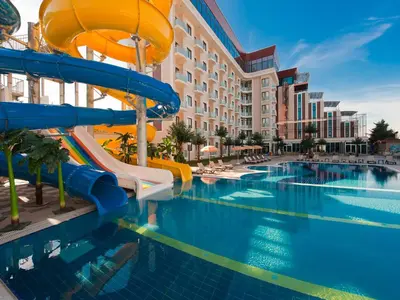 a pool at a resort with a water slide at Elegance Resort Hotel & SPA Wellness-Aqua in Yalova