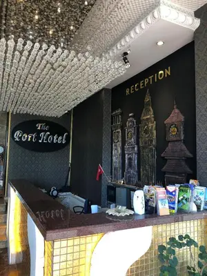 a bar in a restaurant with a sign for the hotel at The Port Hotel in Istanbul