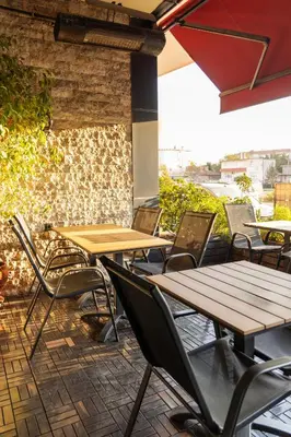 a group of tables and chairs on a patio at Classes Hotel Airport in Istanbul