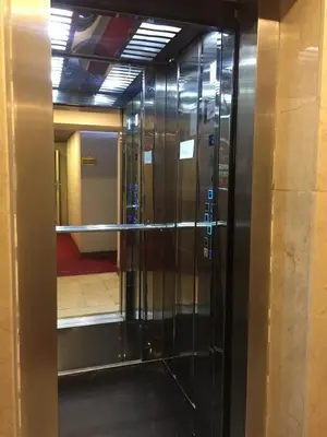 an elevator in a building with a glass door at RİVADA HOTEL in Kartepe