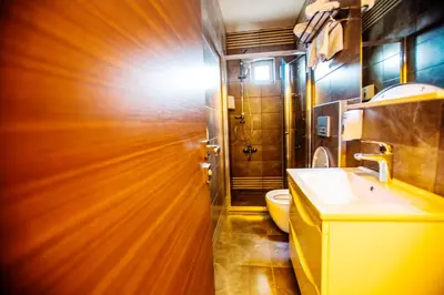 a bathroom with a sink and a toilet at RİVADA HOTEL in Kartepe