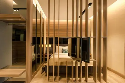 a bedroom with a bed in a glass wall at Nish Palace Exlusive Suites in Istanbul