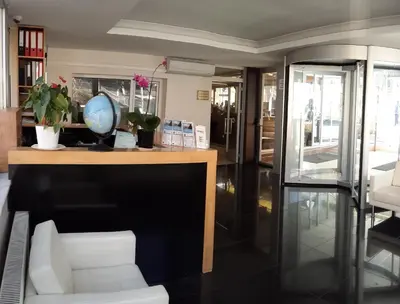 a room with a desk with a globe on it at Payidar HOTEL in Istanbul