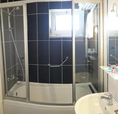 a bathroom with a shower and a sink at Payidar HOTEL in Istanbul