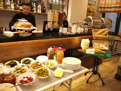 a table with a buffet of food on it at The White Orient Hotel in Istanbul