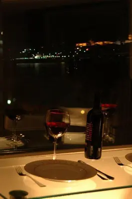 a bottle of wine sitting on a table with a glass at Résidence Le Rêve in Istanbul