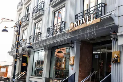 a store front of a building with a sign on it at Novelty Hotel in Istanbul