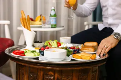 a tray of food on a table with food on it at Novelty Hotel in Istanbul