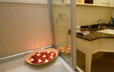 a bathroom with a bowl on the counter next to a shower at Recital Hotel in Istanbul