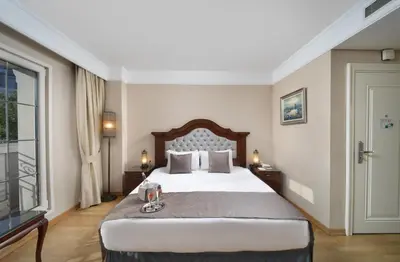 a hotel room with a bed and a window at Recital Hotel in Istanbul