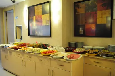 a buffet line with many plates and bowls of food at Merdan Hotel in Istanbul