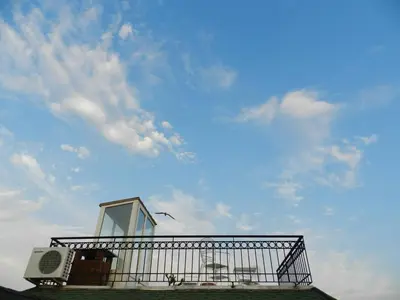 a balcony on top of a building with a sky at Berk Guest House - Grandma's House in Istanbul