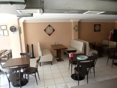 a restaurant with tables and chairs in a room at Istanbul Yildiz Hotel in Marmaraereglisi