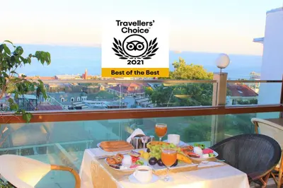 a table with a plate of food on a balcony at Nayla Palace Hotel-Special Category in Istanbul