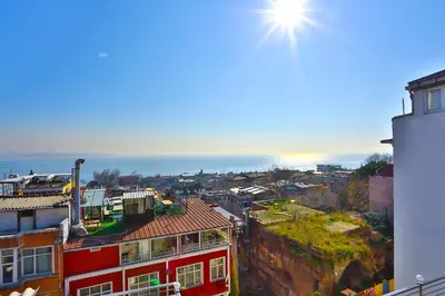 a view of a city with the sun in the sky at Nayla Palace Hotel-Special Category in Istanbul