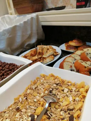 a table topped with different types of food on plates at Nayla Palace Hotel-Special Category in Istanbul