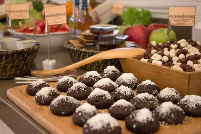 a bunch of chocolate muffins with powdered sugar on them at Goldhan Hotel in Tekirdag