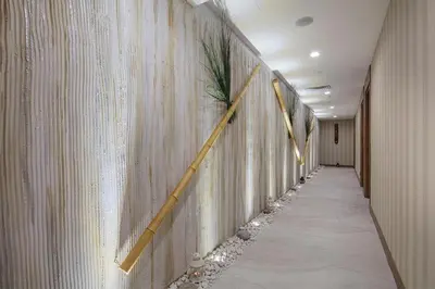 a long hallway with a wall with a long hallway sidx sidx at Hilton Garden Inn Yalova in Yalova