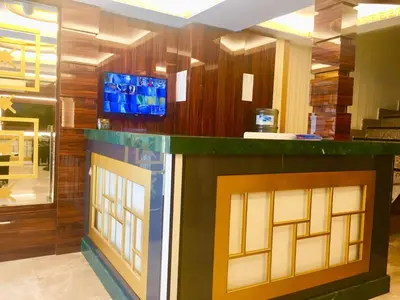 a lobby with a bar with a tv above it at ARINÇ HOTEL in Istanbul