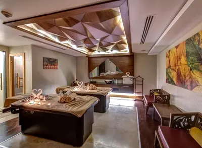 a room with two massage tables and a kitchen at The Elysium Taksim in Istanbul