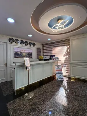 a kitchen with a counter with a sign in a room at Ens Hotel in Istanbul