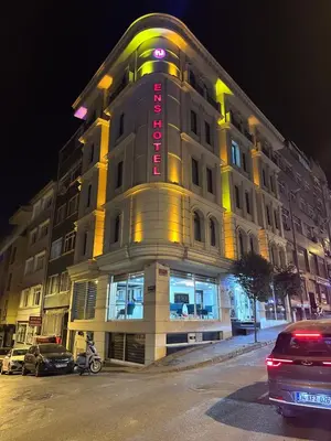 a building with a sign on the front of it at Ens Hotel in Istanbul