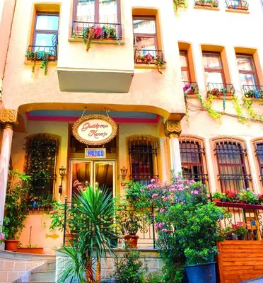 a building with potted plants in front of it at Gedikpasa Konagi Hotel in Istanbul