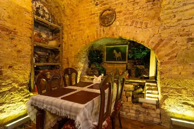 a dining room with a table and chairs in a stone building at Gedikpasa Konagi Hotel in Istanbul