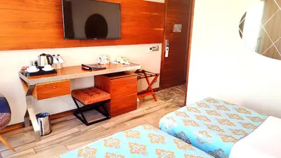 a small room with a desk and a bed at Old Port Hotel in Istanbul