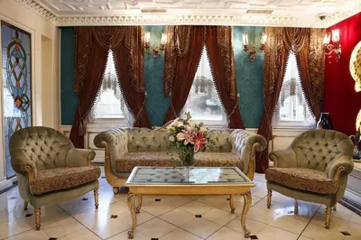 a living room with two couches and a coffee table at Fuat Pasa Oteli - Special Category Bosphorus in Istanbul