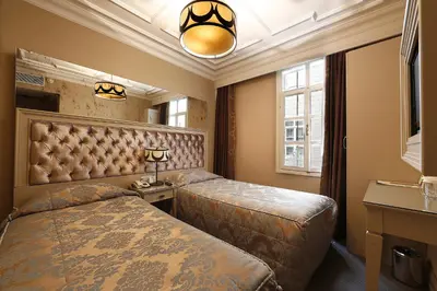 a hotel room with two beds and a window at Fuat Pasa Oteli - Special Category Bosphorus in Istanbul